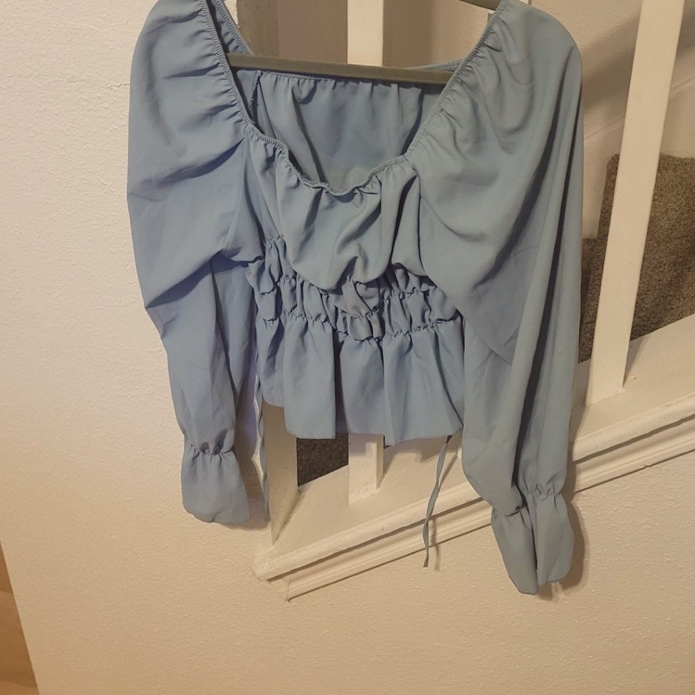 Princess style blue blouse.